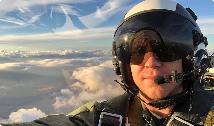 Patrick flying an aircraft above the clouds